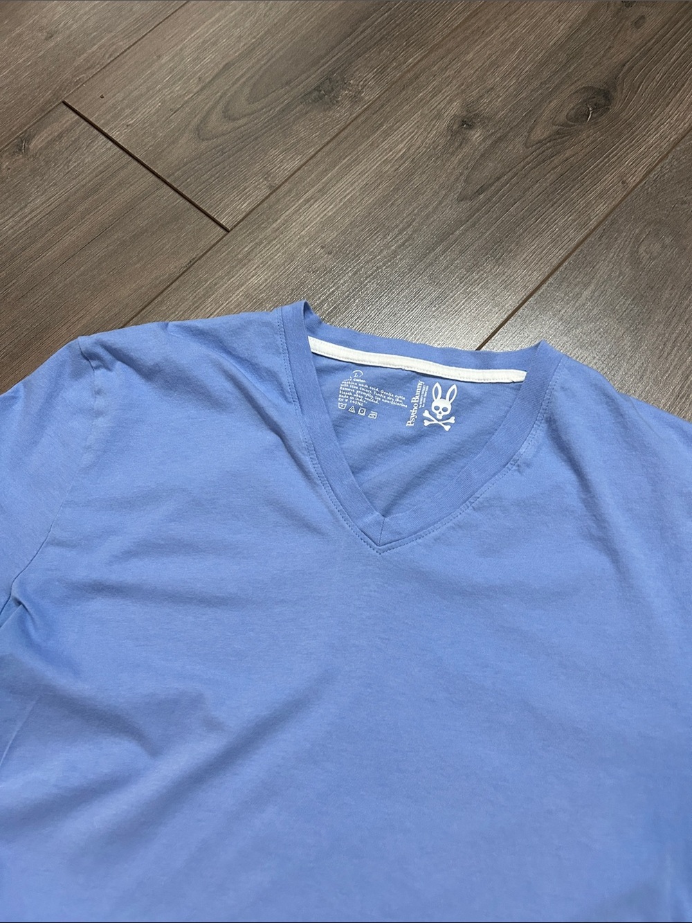 Psycho Bunny Light Blue V-Neck Tee with Skull & Crossbones Print